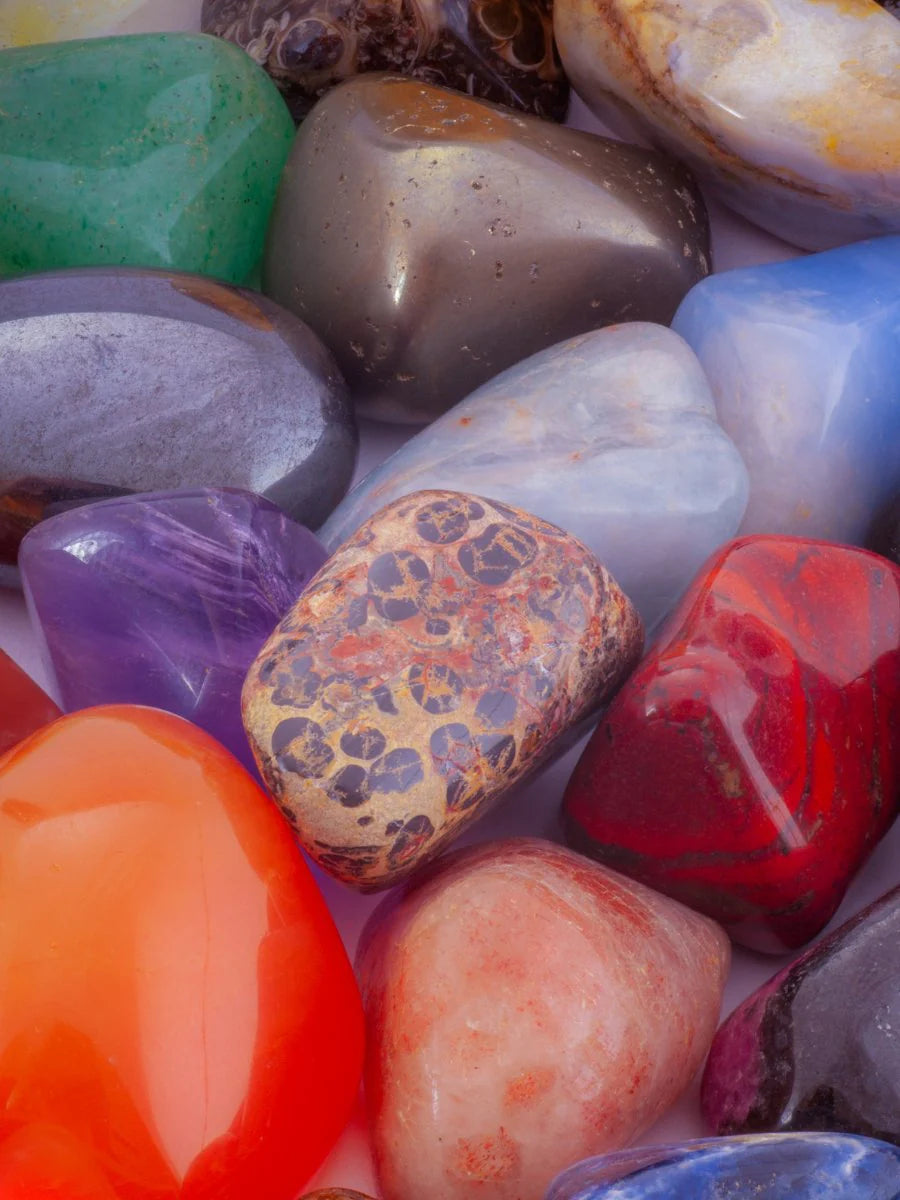 A collection of various tumbled stones of bright colors