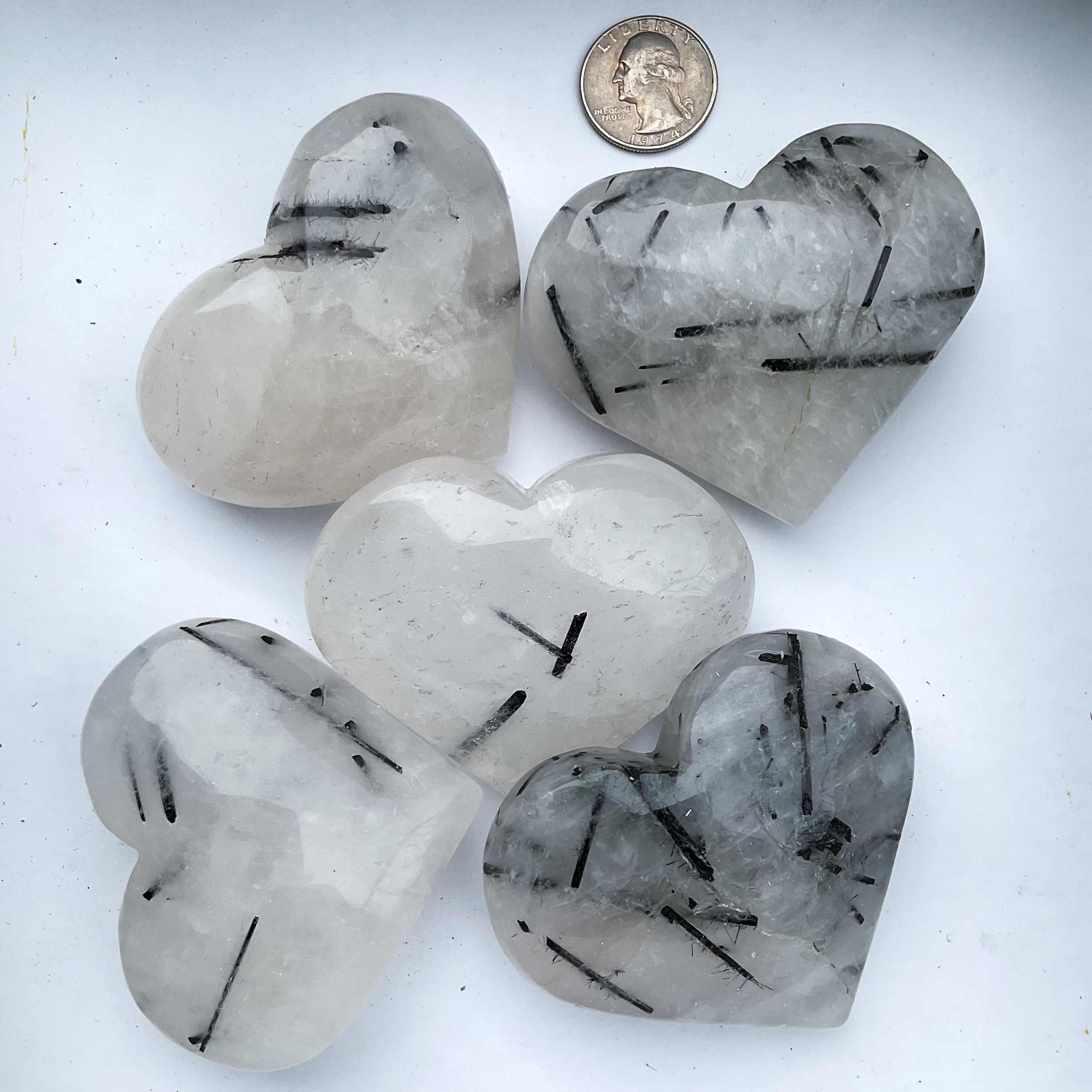 Crystal heart carvings in tourmaline in quartz